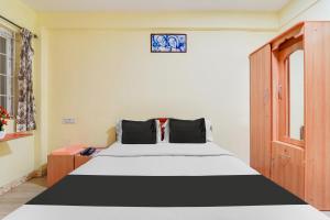 Postel nebo postele na pokoji v ubytování Super Hotel O Airport Road Coimbatore