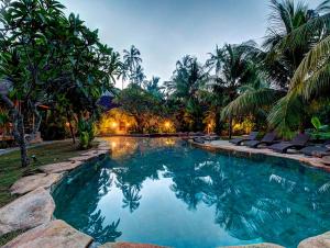The swimming pool at or near Ganesh Lodge