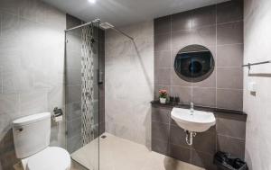 a bathroom with a toilet and a sink at Hide & Seek Resort Krabi in Ban Khlong Chi Lat +46 photos