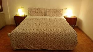 Un pat sau paturi într-o cameră la Appartamento Masi