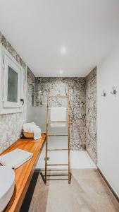 a bathroom with a ladder and a sink and a shower at Seraphina Bookings Mojacar in Mojácar +54 photos