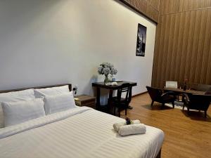 Postel nebo postele na pokoji v ubytování Moc Nha Minh Hotel Da Lat