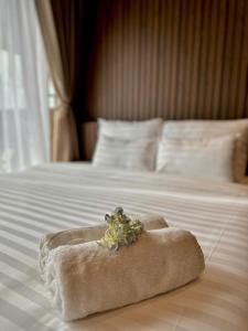 Postel nebo postele na pokoji v ubytování Moc Nha Minh Hotel Da Lat