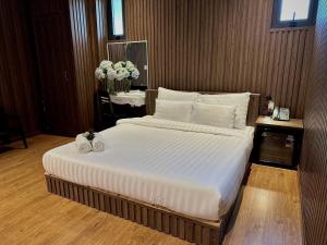 Postel nebo postele na pokoji v ubytování Moc Nha Minh Hotel Da Lat