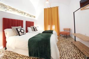 Ένα ή περισσότερα κρεβάτια σε δωμάτιο στο Apartamentos Durán Pizarro 1930