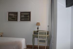 A bed or beds in a room at Hotel Villa Maria