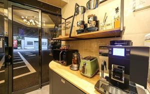 Η κουζίνα ή μικρή κουζίνα στο Button Hotel