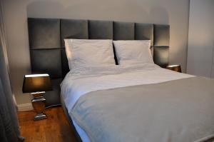 Un pat sau paturi într-o cameră la Apartament Kewin