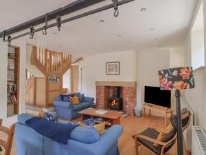 Televiisor ja/või meelelahutuskeskus majutusasutuses Yard Cottage