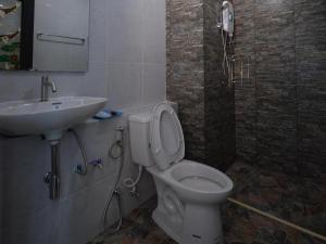 a bathroom with a toilet and a sink at Sixty-Sixplace in Trang +50 photos