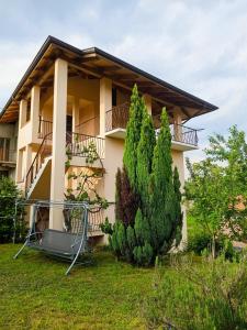 a house with two trees in front of it at Casa Anna in Crosa