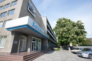 a building with a car parked in front of it at Kremin Hotel in Kremenchuk
