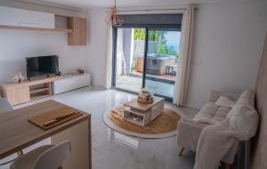 TV a/nebo společenská místnost v ubytování Sea View & Spa