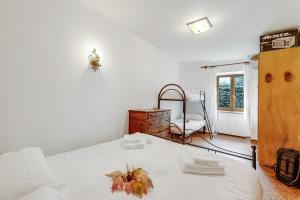 Postel nebo postele na pokoji v ubytování Appartamento Vecchio Gad - Happy Rentals
