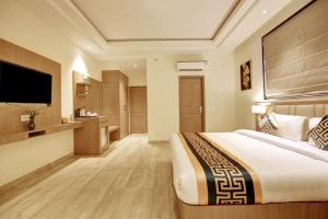 Postel nebo postele na pokoji v ubytování Hotel City Lite Near Delhi Airport