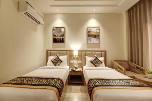 Postel nebo postele na pokoji v ubytování Hotel City Lite Near Delhi Airport