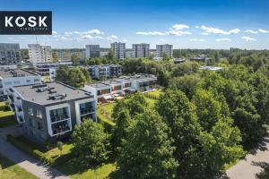 an aerial view of a city with buildings and trees at Seaside new home with sunny balcony in Pärnu