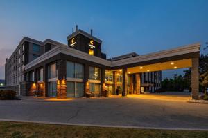 a large building with a clock tower on top of it at Comfort Inn & Conference Centre Toronto Airport in Toronto