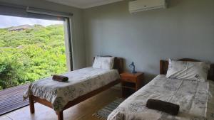 Voodi või voodid majutusasutuse The View - Xai Xai Mozambique Xai Xai Beach Front 180 Degree Sea Views toas