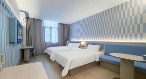 Postel nebo postele na pokoji v ubytování Hanting Premium Hotel Shanghai Xizang Nan Road