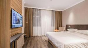 Postel nebo postele na pokoji v ubytování Hanting Premium Hotel Shanghai Xizang Nan Road