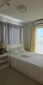 Ένα ή περισσότερα κρεβάτια σε δωμάτιο στο One oasis 3rdfloor with balcony 2br