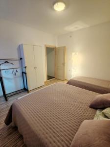 Postel nebo postele na pokoji v ubytování Apartment Oscar