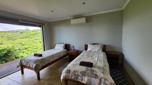 Voodi või voodid majutusasutuse The View - Xai Xai Mozambique Xai Xai Beach Front 180 Degree Sea Views toas