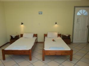 Posteľ alebo postele v izbe v ubytovaní Rigos Apartments