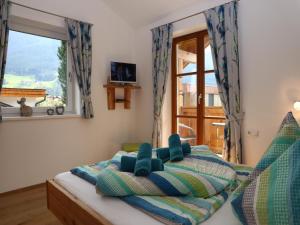 Postel nebo postele na pokoji v ubytování Apartment in Bramberg am Wildkogel with parking space + 30 fotografií