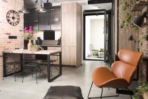 a kitchen with a table and chairs in a room at DG space 1A in Kalamata +31 photos