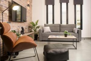 a living room with a couch and a table at DG space 1A in Kalamata