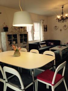 a living room with a table and chairs at Dům na Lipně in Lipno nad Vltavou