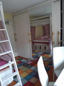 a room with a bunk bed and a ladder at Dominique in Hohenfels
