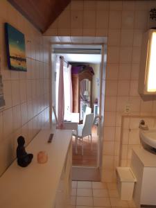 a small kitchen with a sink and a table at Dominique in Hohenfels