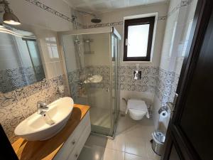 Koupelna v ubytování Derya Beach Apartment + 37 fotografií