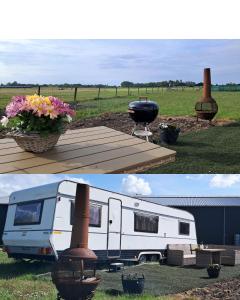 a white trailer parked in a field with a grill at De Rozenbottel met privé sanitair in Hensbroek