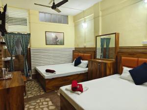 Postel nebo postele na pokoji v ubytování Hotel Raj