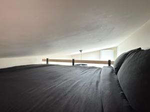 Letto o letti in una camera di Studio Lumineux Mezzanine à 10 minutes de Disney