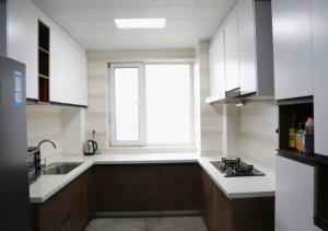 Кухня або міні-кухня у Boxianyuan Three-Bedroom Apartment