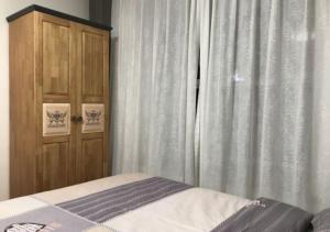 Ліжко або ліжка в номері Boxianyuan Three-Bedroom Apartment