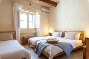 Postel nebo postele na pokoji v ubytování Gozobreak Farmhouses