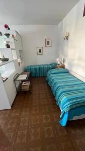 Ένα ή περισσότερα κρεβάτια σε δωμάτιο στο Casa di Patty +6 φωτογραφίες