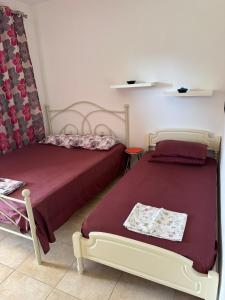 Postel nebo postele na pokoji v ubytování Toroni House!