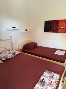 Postel nebo postele na pokoji v ubytování Toroni House!