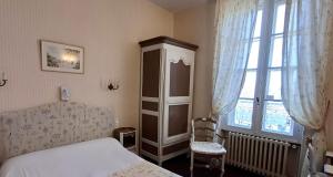 Postel nebo postele na pokoji v ubytování Hotel Montsegur
