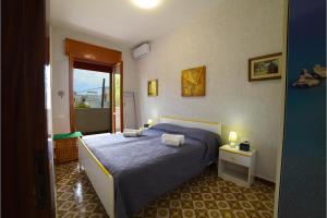 Ένα ή περισσότερα κρεβάτια σε δωμάτιο στο Casa Atena On Seashore - Happy Rentals