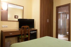 TV a/nebo společenská místnost v ubytování Hotel Hidalgo Quijada