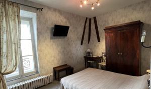 Postel nebo postele na pokoji v ubytování Hotel Montsegur