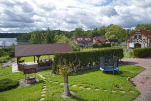 a park with a playground and a picnic table at Uroczysko Lutówko in Sępólno Krajeńskie